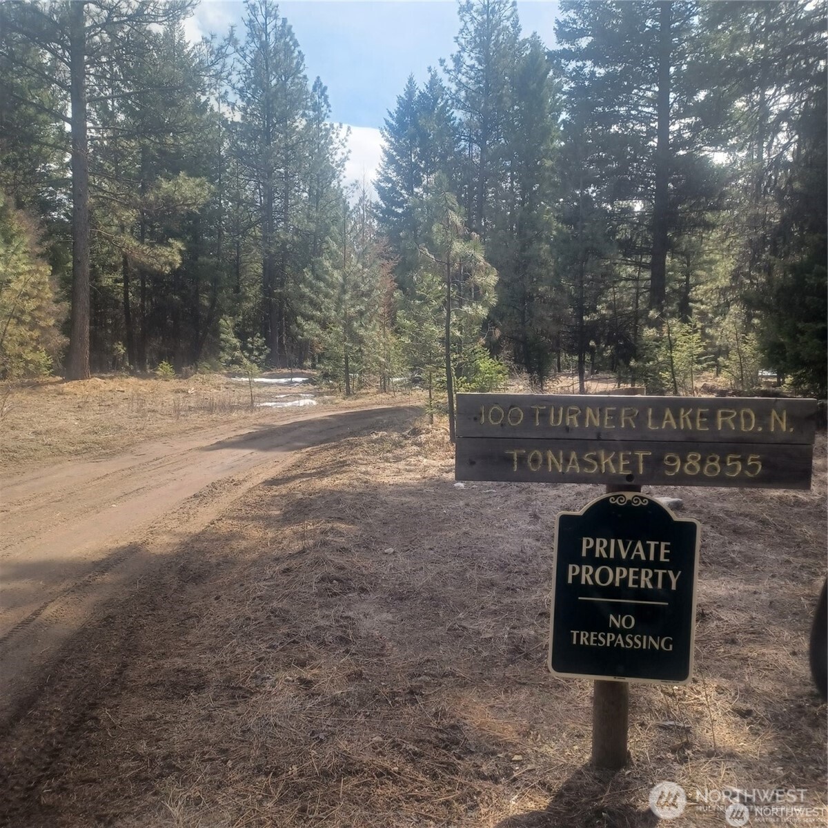 100 Turner Lake Road North Tonasket, WA 98855 - Photo 23 of 39 a view of a street sign under a large tree