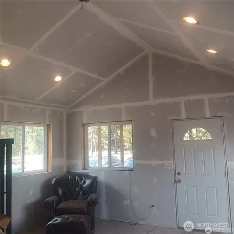 a living room with furniture and windows
