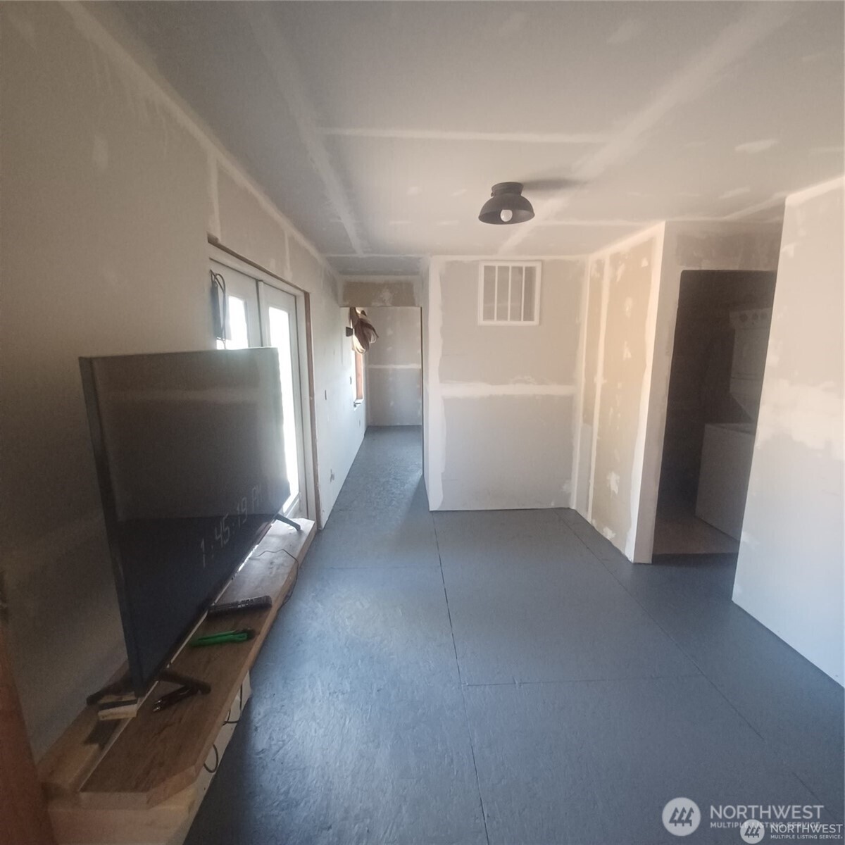 100 Turner Lake Road North Tonasket, WA 98855 - Photo 10 of 39 wooden floor in an empty room with a window