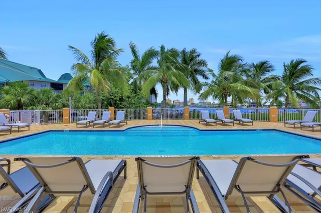 a view of a swimming pool and lounge chair