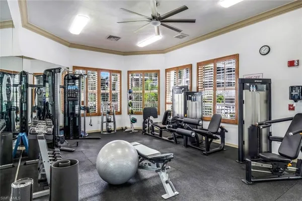 a room with gym equipment and a large window