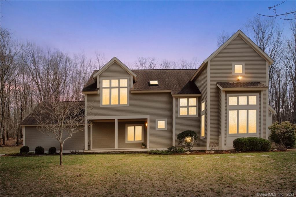 a front view of a house with a yard