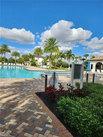 a view of a lake with a houses in the back