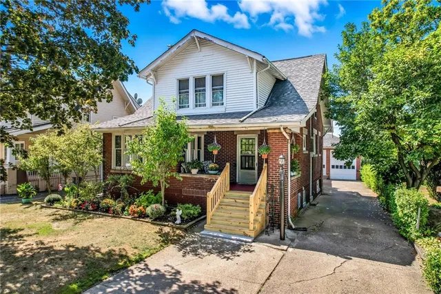 a front view of a house with garden