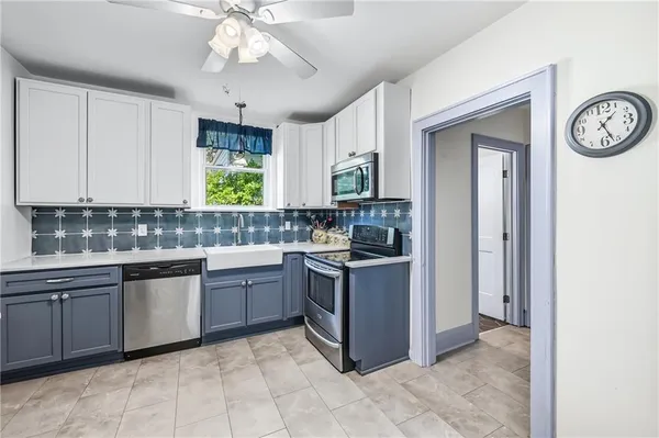 a kitchen with a sink cabinets and window