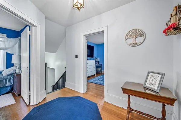 a view of room with furniture and wooden floor