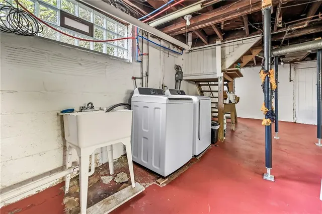 a utility room with dryer and washer