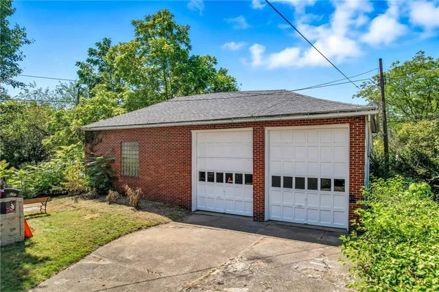 a front view of a house with garage