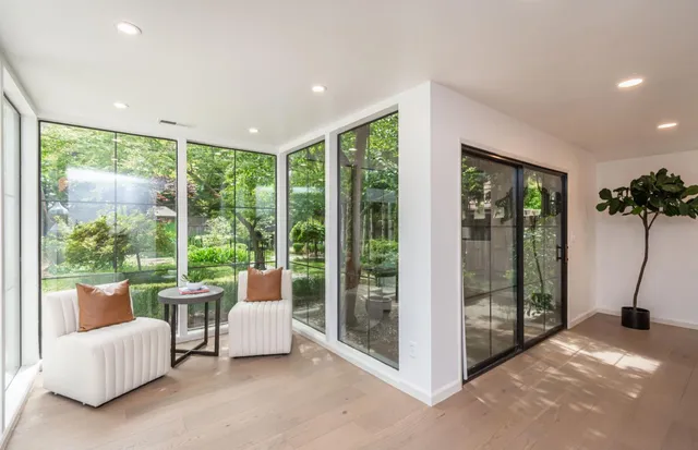 a living room with couch and a large window