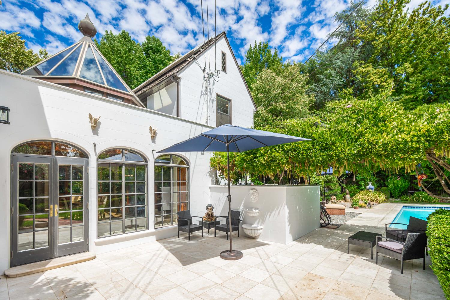 436 Hopkins Road Sacramento, CA 95864 - Photo 23 of 25 a view of a patio with table and chairs and potted plants