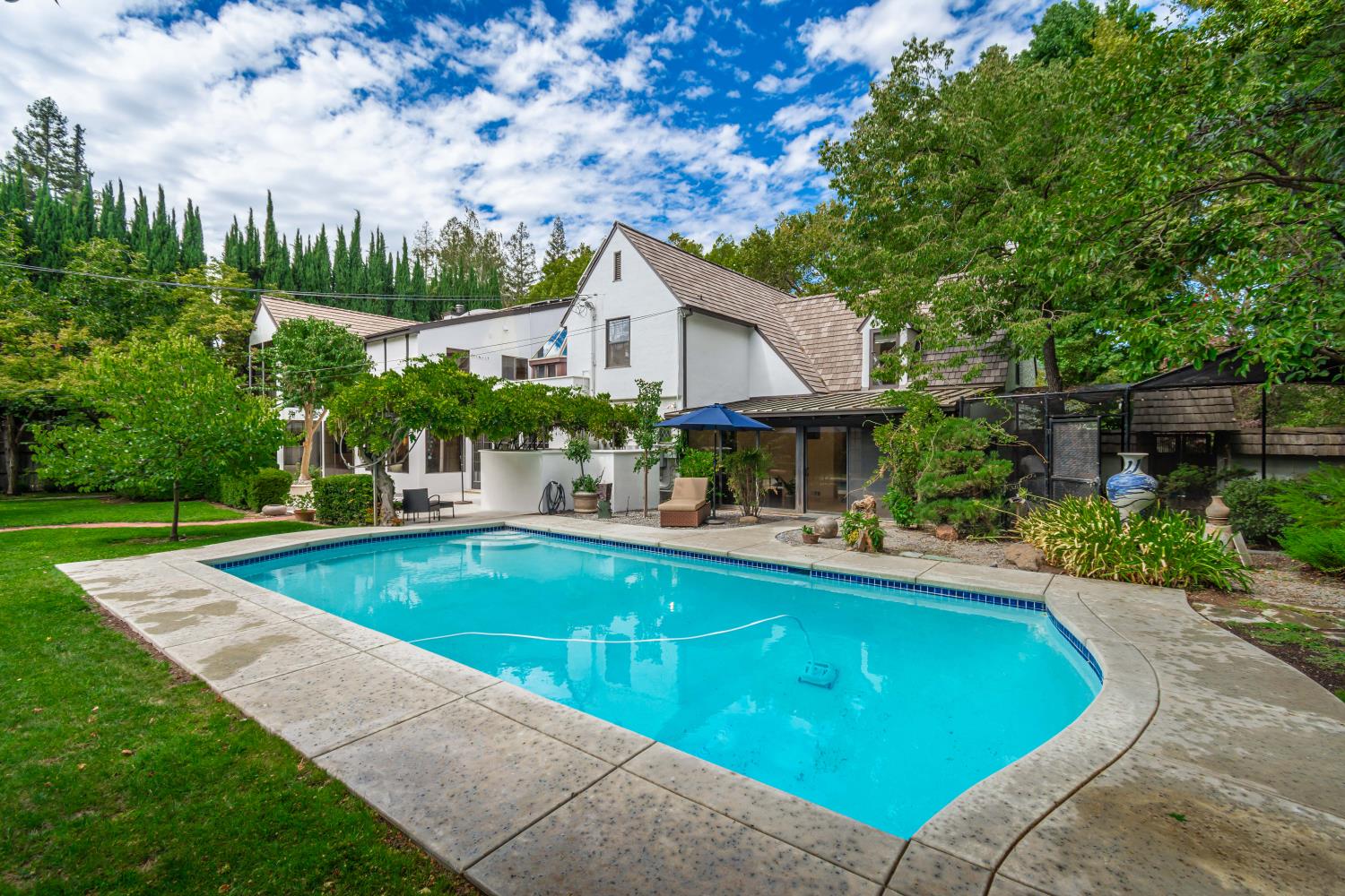 436 Hopkins Road Sacramento, CA 95864 - Photo 24 of 25 a view of a house with swimming pool and sitting area