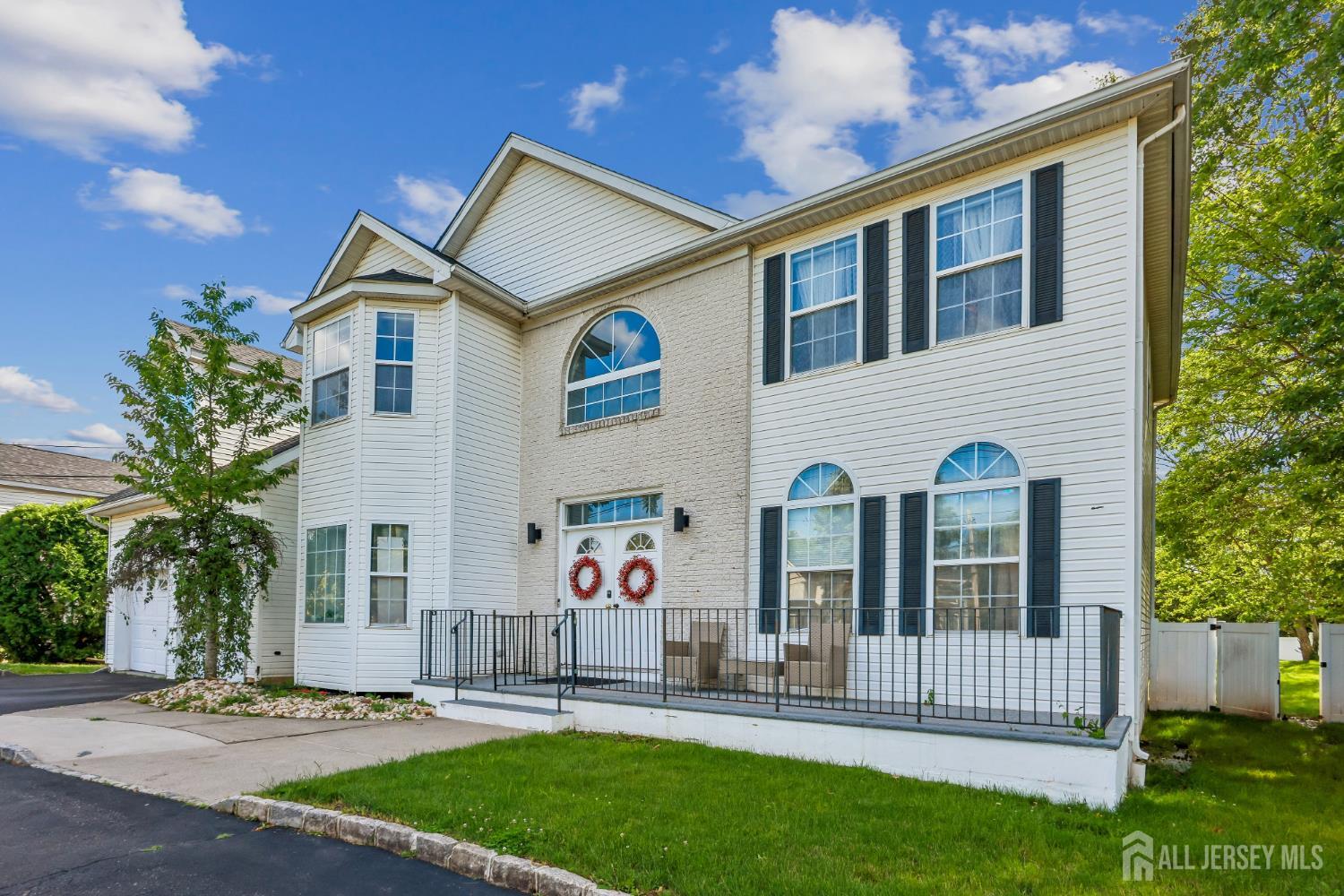 489 Plainfield Road Edison, NJ 08820 - Photo 2 of 39 a front view of house with yard and green space