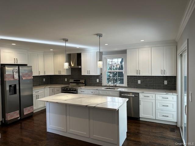 25 Maple Place Hicksville, NY 11801 - Photo 5 of 14 a kitchen with stainless steel appliances granite countertop a sink stove and refrigerator