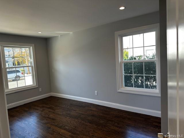 25 Maple Place Hicksville, NY 11801 - Photo 10 of 14 an empty room with wooden floor and windows