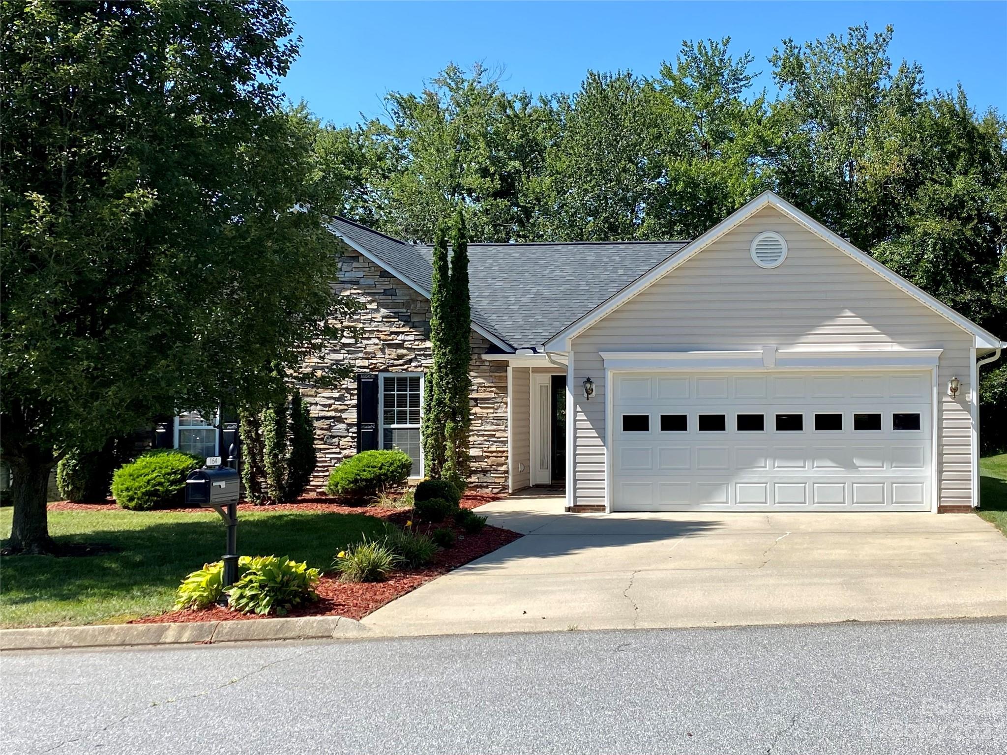 164 Cottage Ridge Road Fletcher, NC 28732 - Photo 1 of 23 a view of a house with a yard plants and large tree