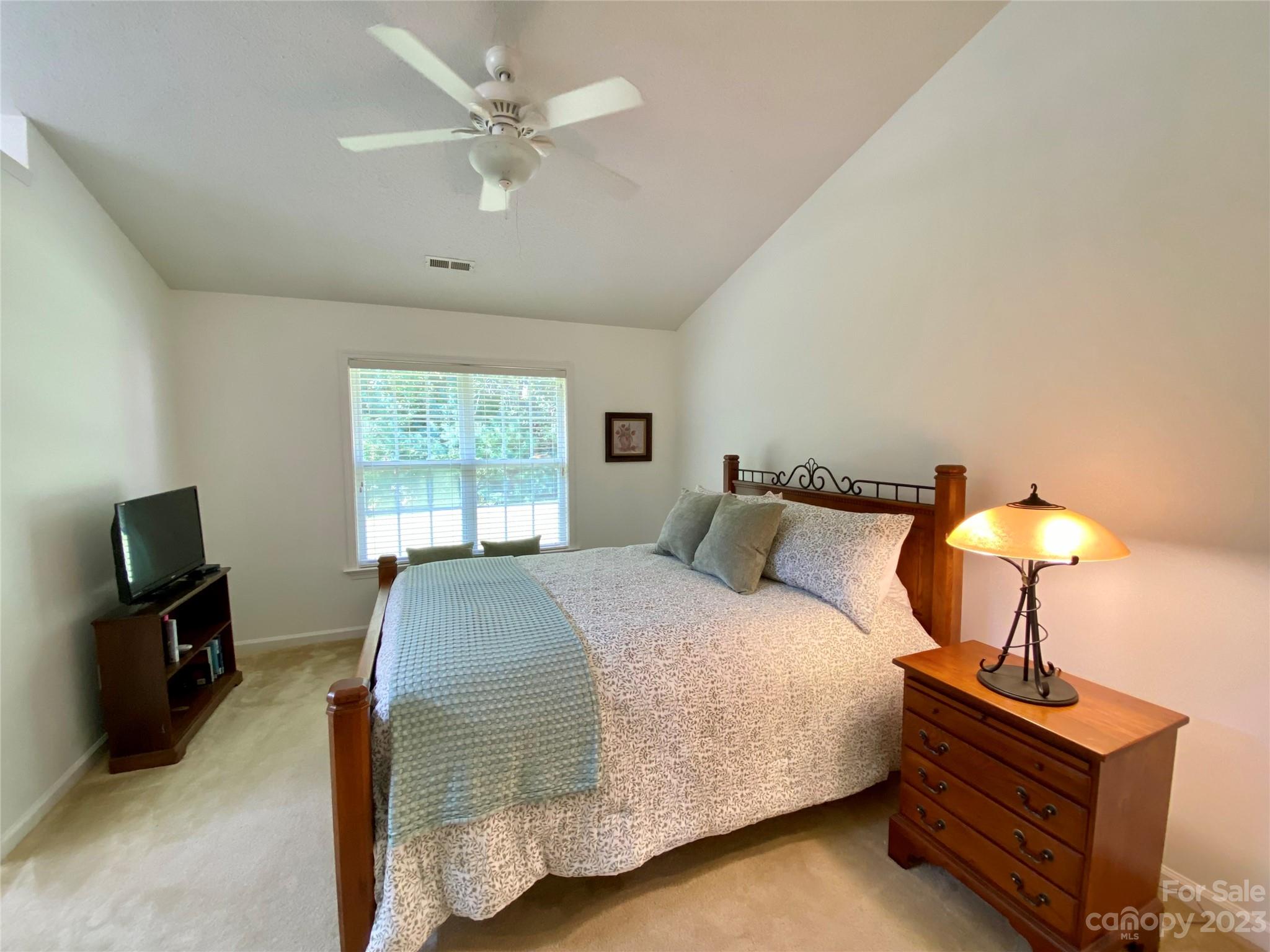 164 Cottage Ridge Road Fletcher, NC 28732 - Photo 12 of 23 a bedroom with a bed and a tv
