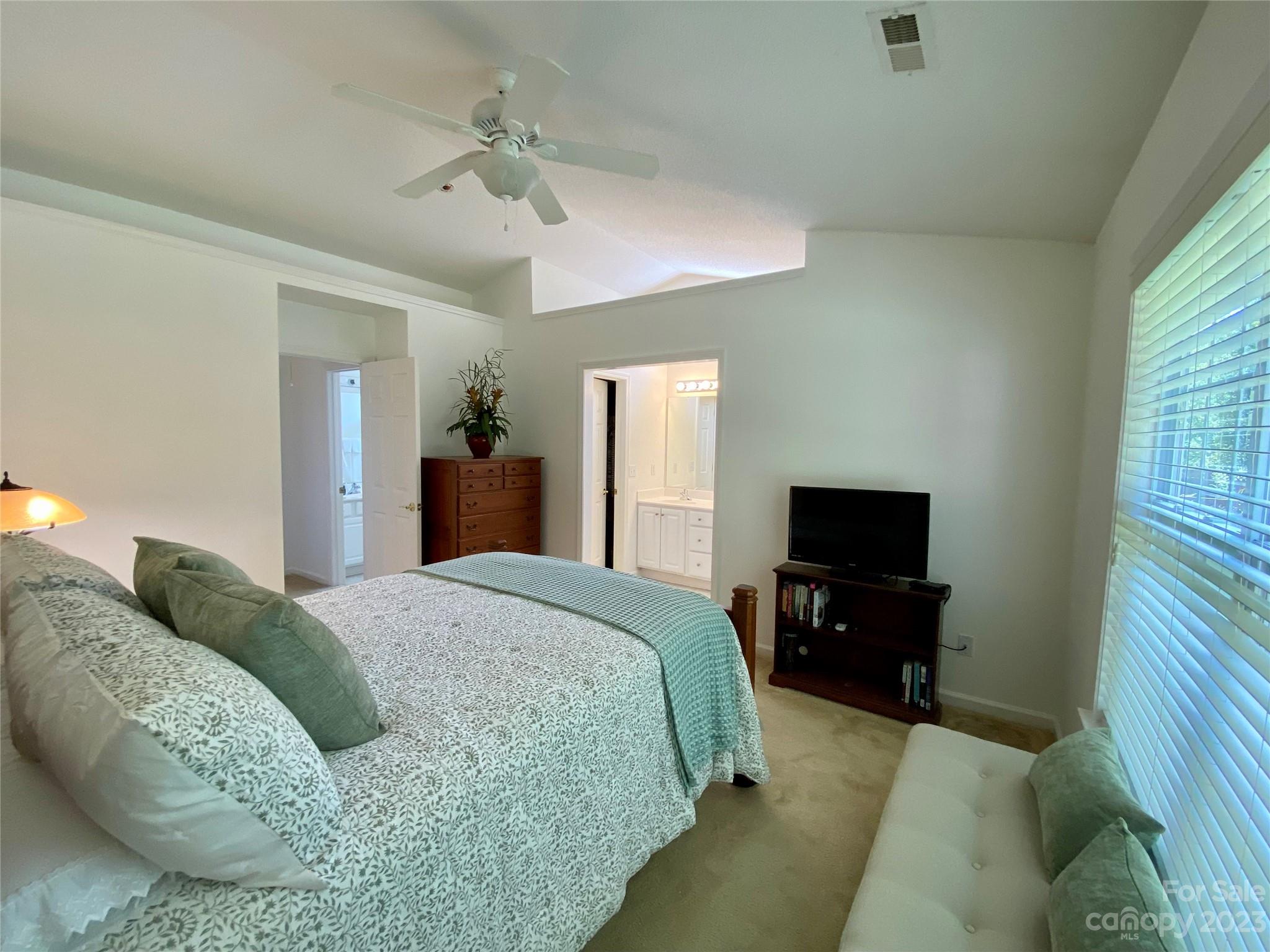 164 Cottage Ridge Road Fletcher, NC 28732 - Photo 13 of 23 a spacious bedroom with a bed and a flat screen tv