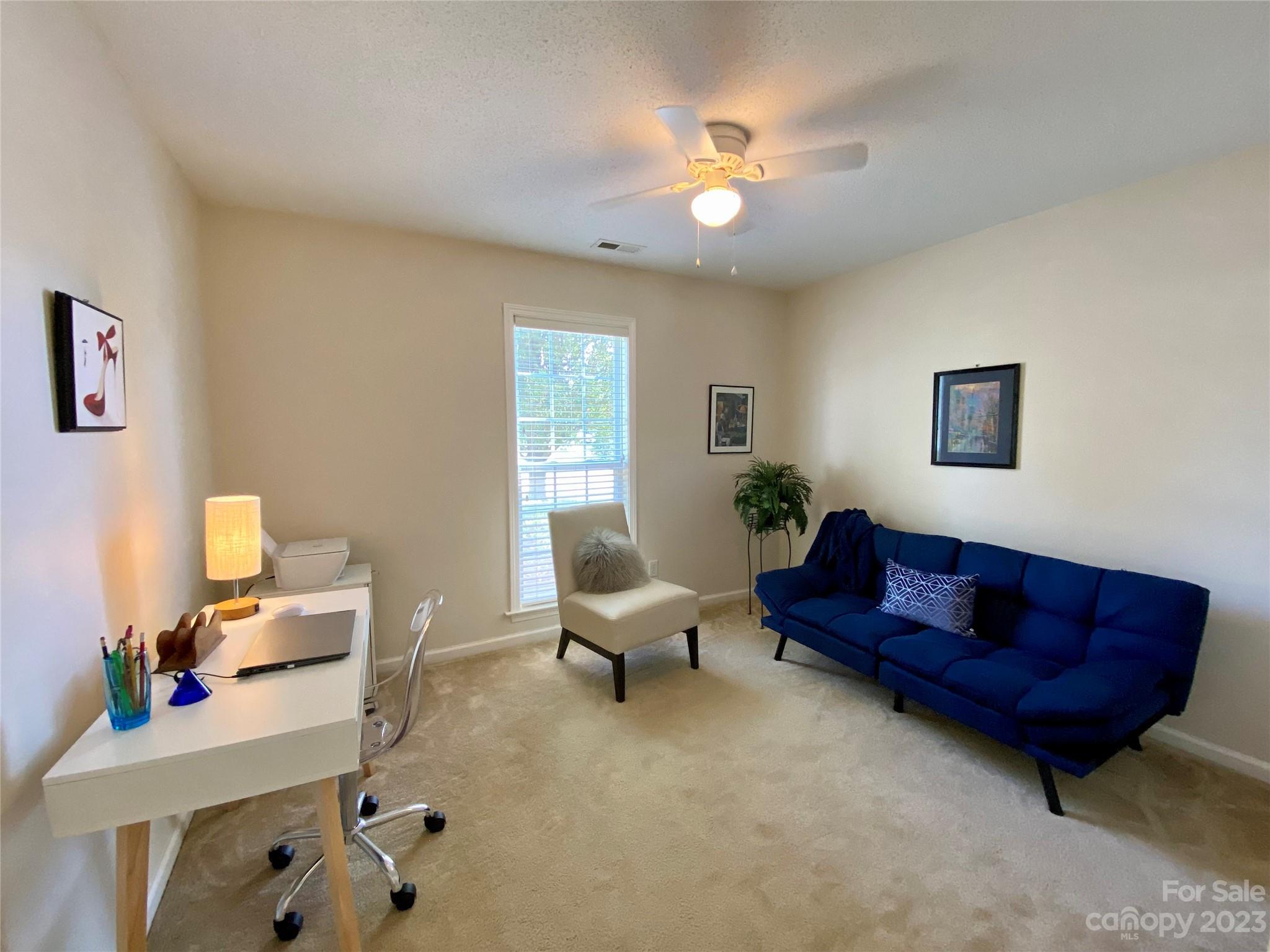164 Cottage Ridge Road Fletcher, NC 28732 - Photo 16 of 23 a living room with furniture and a potted plant
