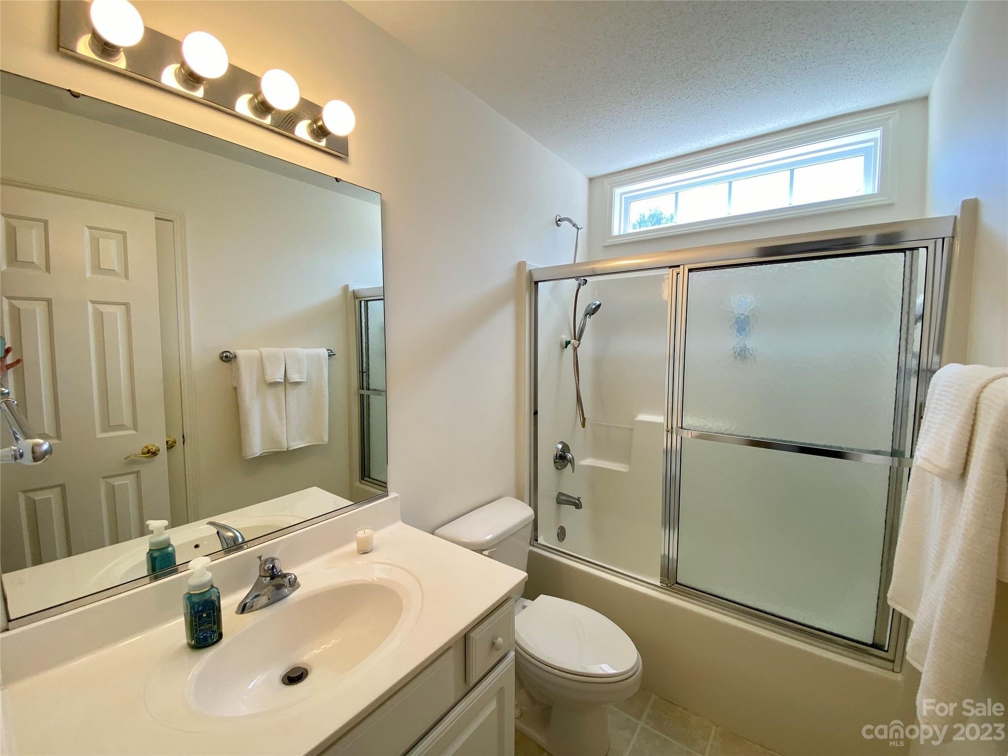 164 Cottage Ridge Road Fletcher, NC 28732 - Photo 18 of 23 a bathroom with a sink toilet and shower