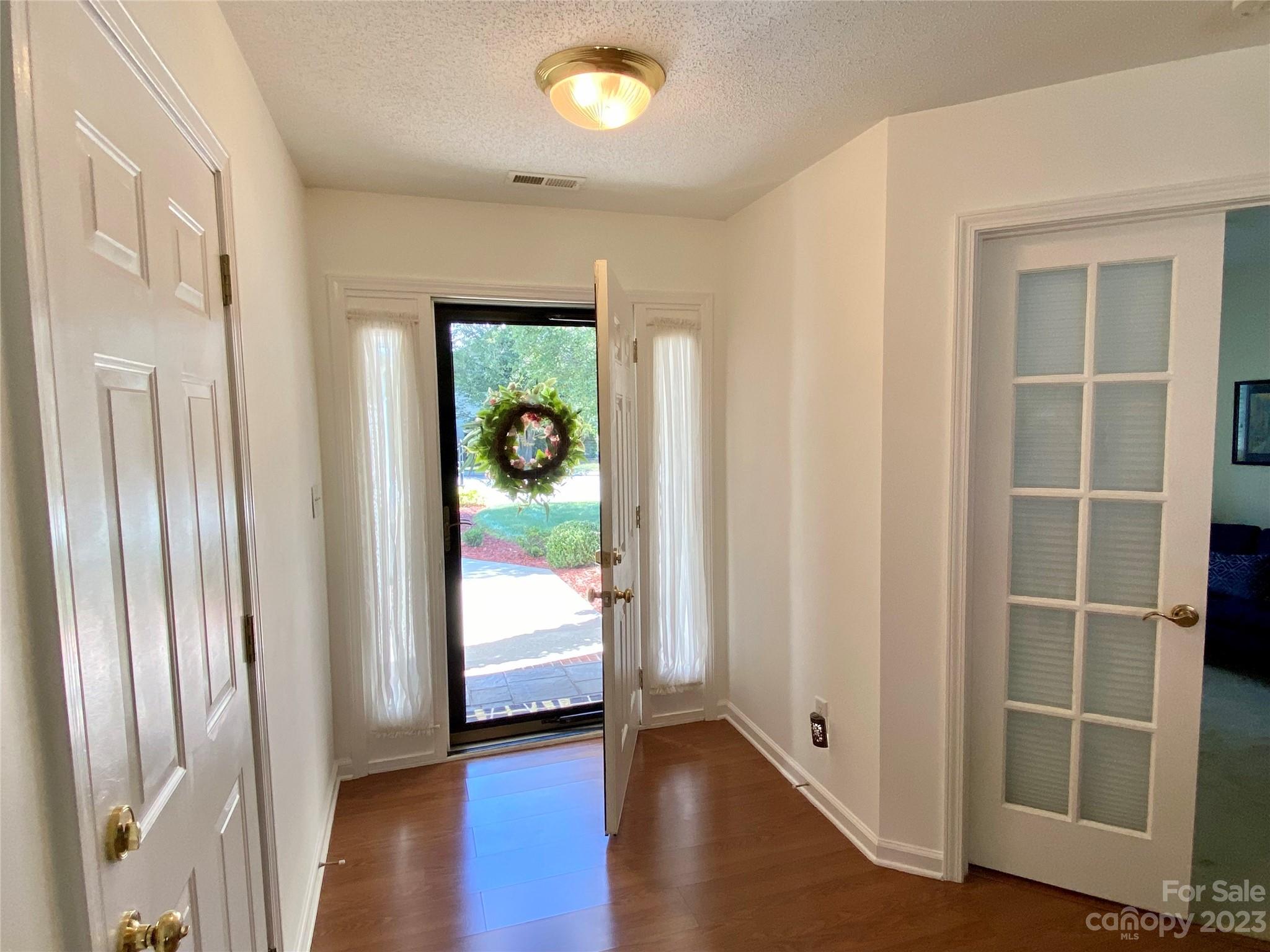 164 Cottage Ridge Road Fletcher, NC 28732 - Photo 2 of 23 an empty room with wooden floor and windows