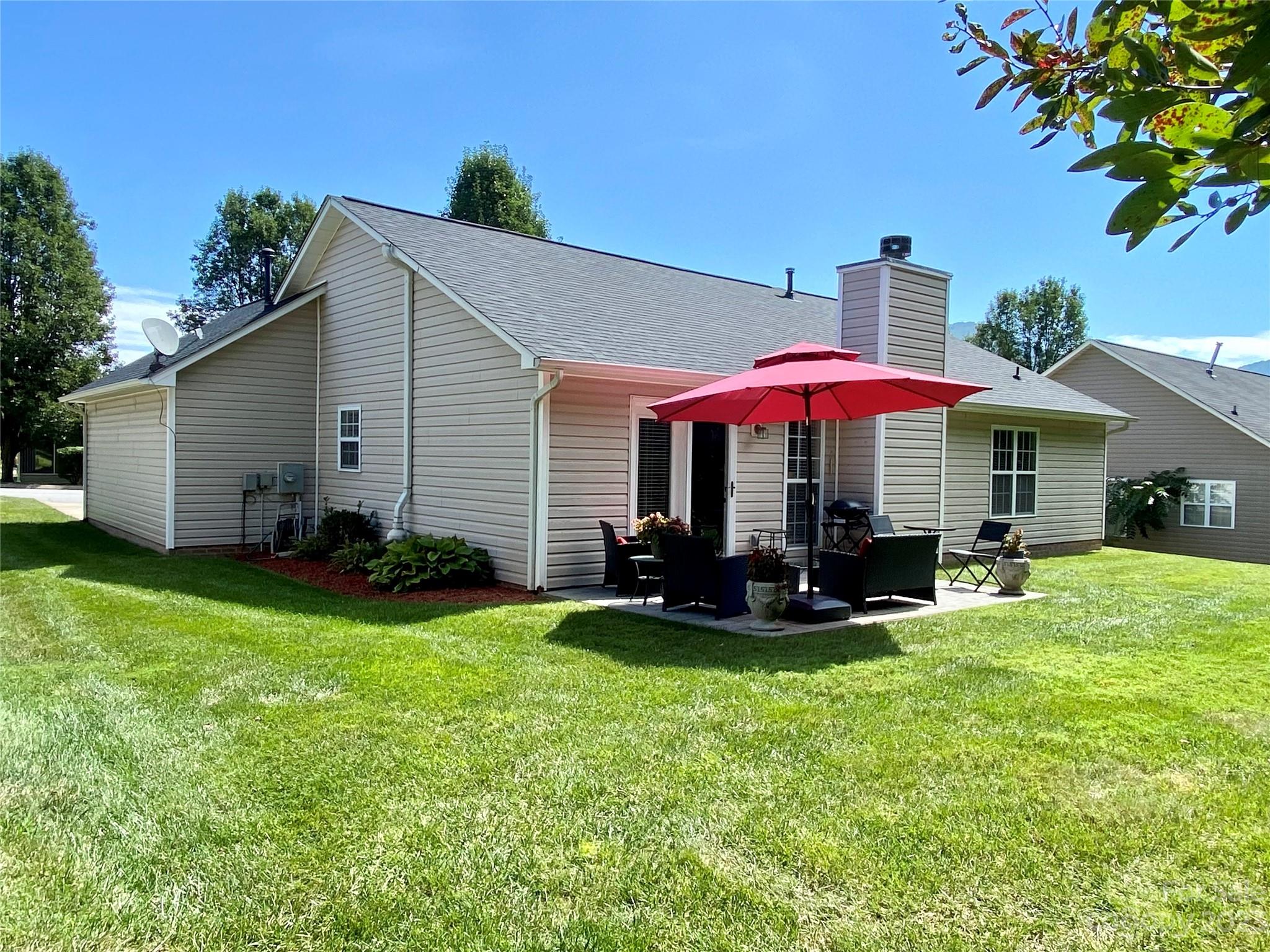 164 Cottage Ridge Road Fletcher, NC 28732 - Photo 21 of 23 a view of a house with backyard and sitting area