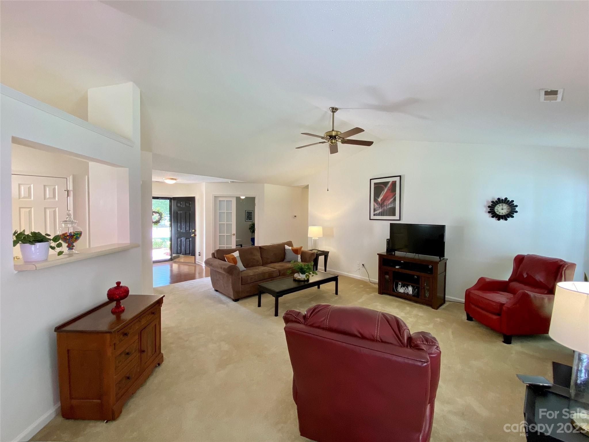 164 Cottage Ridge Road Fletcher, NC 28732 - Photo 3 of 23 a living room with furniture and a flat screen tv