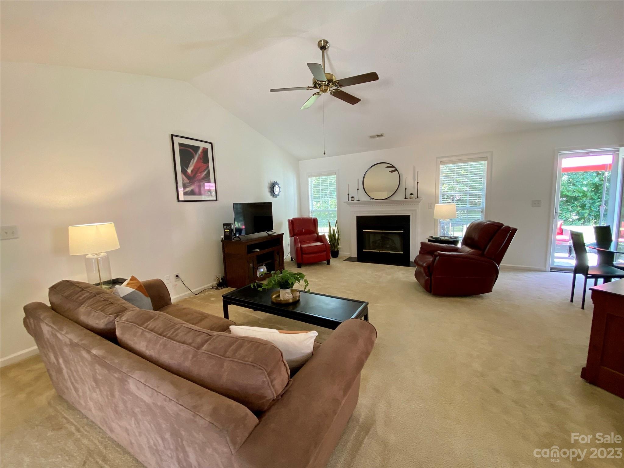 164 Cottage Ridge Road Fletcher, NC 28732 - Photo 5 of 23 a living room with furniture a fireplace and a flat screen tv