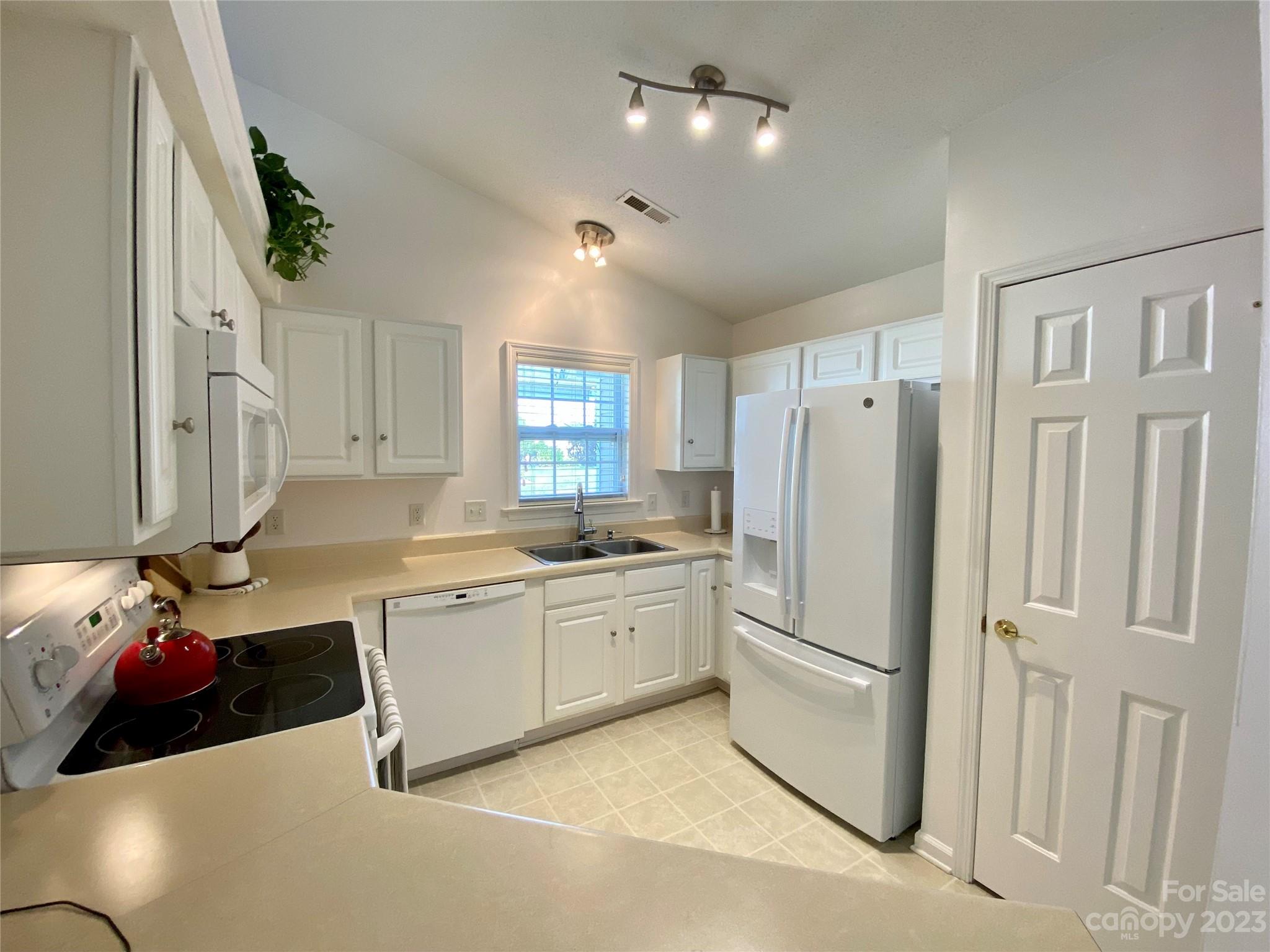 164 Cottage Ridge Road Fletcher, NC 28732 - Photo 9 of 23 a kitchen with a sink stainless steel appliances and cabinets
