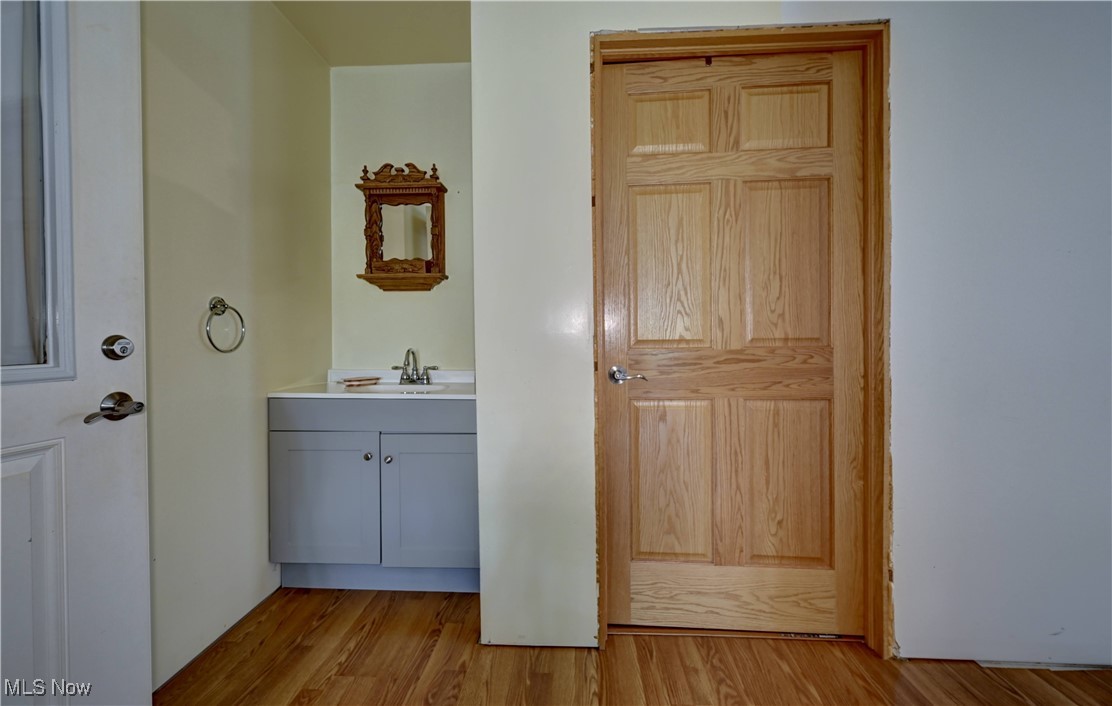 91240 Kilgore Ridge Road Scio, OH 43988 - Photo 19 of 43 Bathroom featuring light wood finished floors and vanity