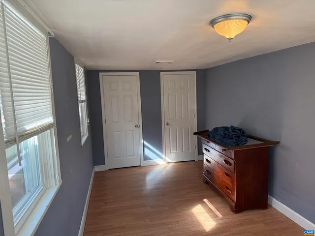 a kitchen with granite countertop a stove and a refrigerator