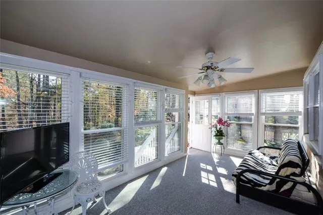 a view of a yard with wooden fence