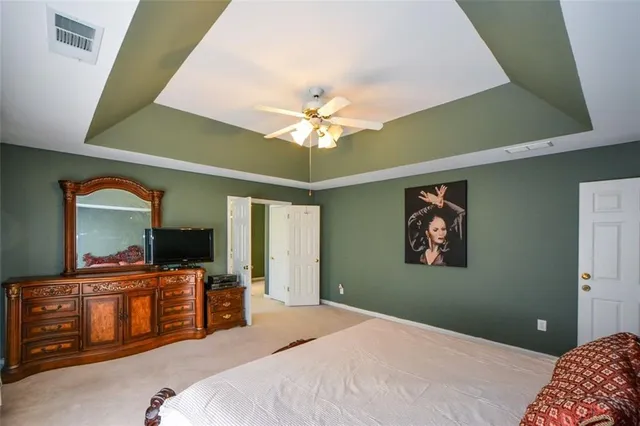 a bathroom with a sink and mirror with toilet