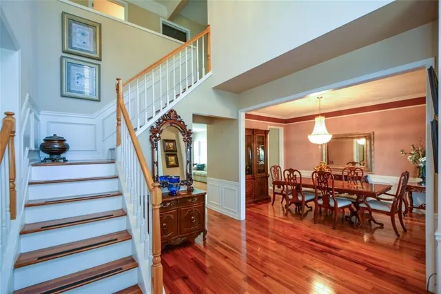 a view of a livingroom with furniture and hardwood floor