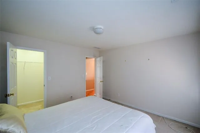 a bathroom with a granite countertop sink and a mirror with toilet
