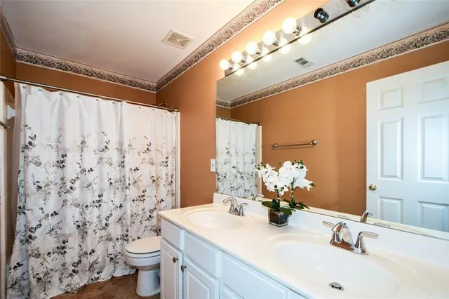 a view of a house with swimming pool and sitting area