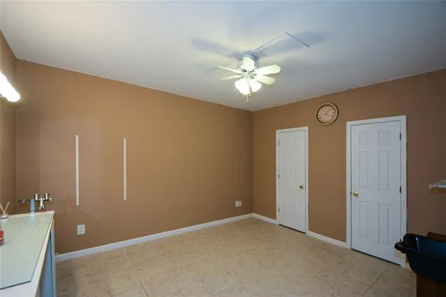 a view of a patio with table and chairs under an umbrella