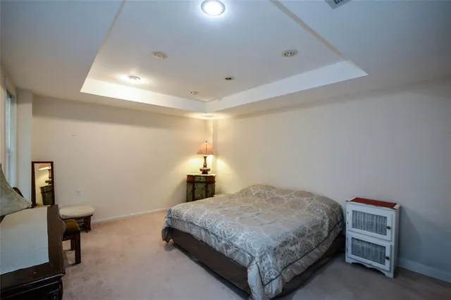 a view of a house with snow on the side of the road