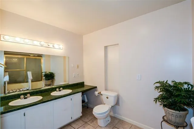 an aerial view of residential house with yard and swimming pool