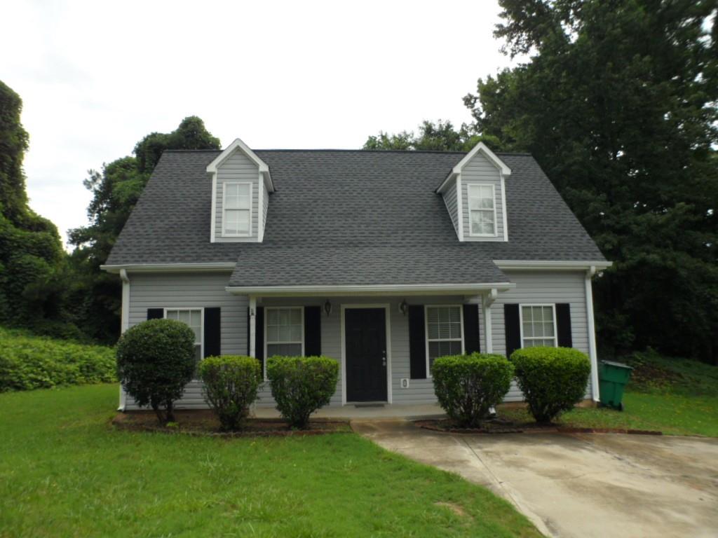 276 Griffith Street Winder, GA 30680 - Photo 1 of 1 a view of a house with a yard and plants