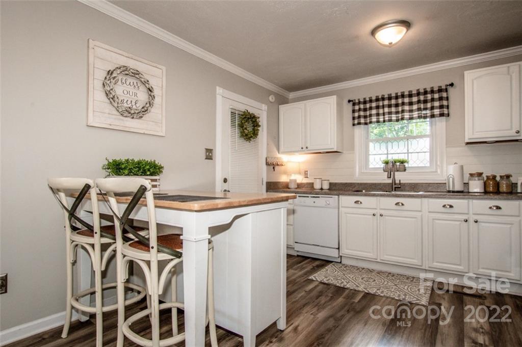406 Fieldstone Road Mooresville, NC 28115 - Photo 20 of 43 a kitchen with stainless steel appliances granite countertop a white cabinets and a stove top oven