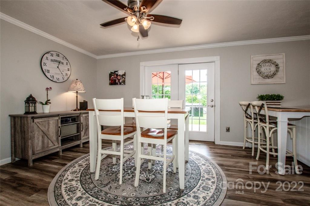 406 Fieldstone Road Mooresville, NC 28115 - Photo 21 of 43 a view of a dining room with furniture window and wooden floor