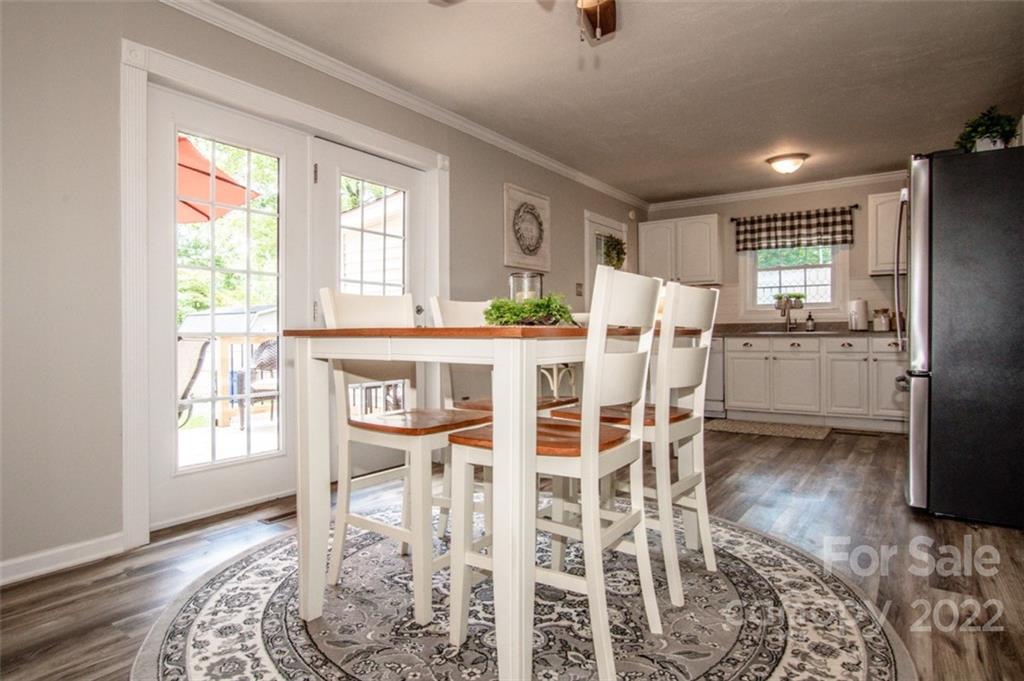 406 Fieldstone Road Mooresville, NC 28115 - Photo 22 of 43 a dining room with furniture and window