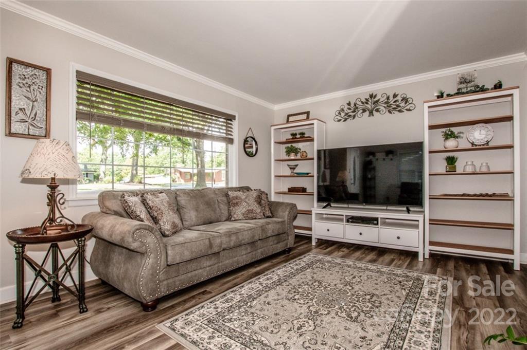 406 Fieldstone Road Mooresville, NC 28115 - Photo 25 of 43 a living room with furniture and a flat screen tv