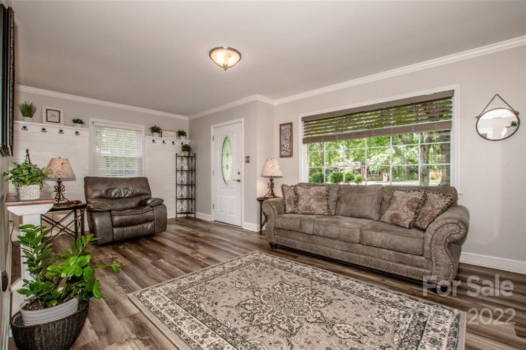 406 Fieldstone Road Mooresville, NC 28115 - Photo 26 of 43 a living room with furniture and a large window