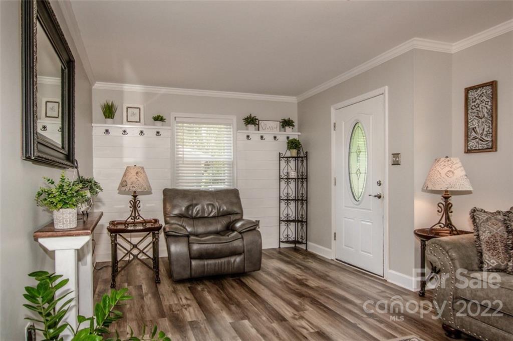 406 Fieldstone Road Mooresville, NC 28115 - Photo 27 of 43 a living room with furniture and a wooden floor