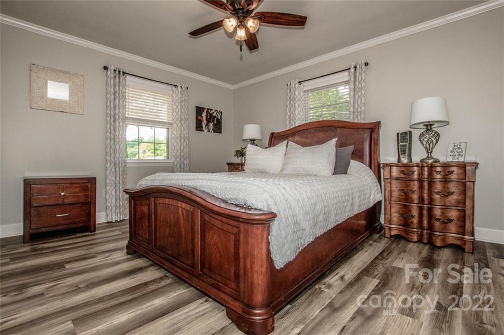 406 Fieldstone Road Mooresville, NC 28115 - Photo 33 of 43 a bedroom with a bed and a dresser