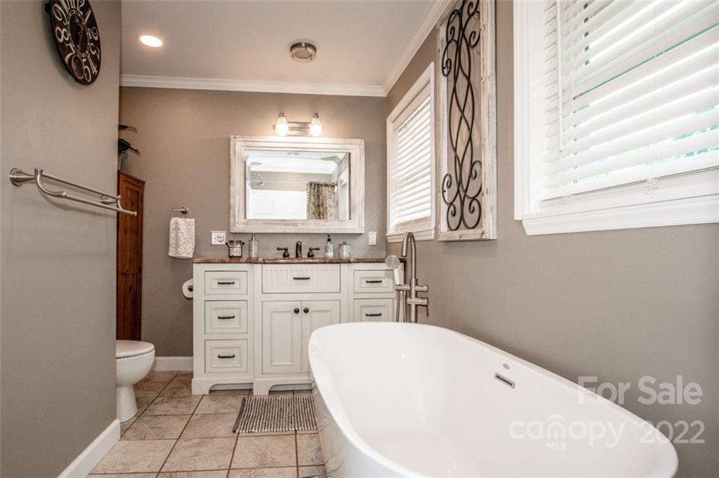 406 Fieldstone Road Mooresville, NC 28115 - Photo 37 of 43 a bathroom with a sink a toilet and a bathtub