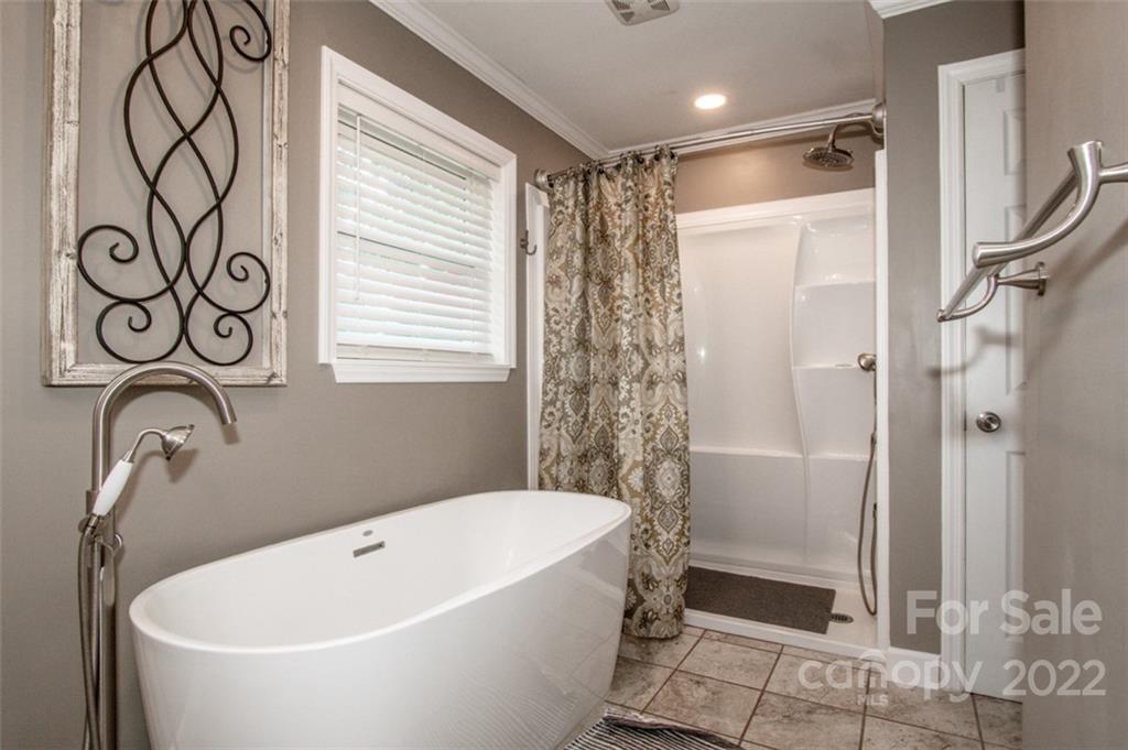406 Fieldstone Road Mooresville, NC 28115 - Photo 38 of 43 a bathroom with a bathtub and shower