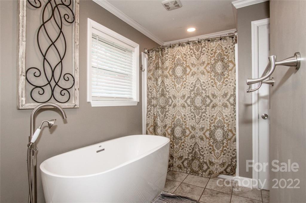 406 Fieldstone Road Mooresville, NC 28115 - Photo 39 of 43 a bathroom with a bathtub and shower