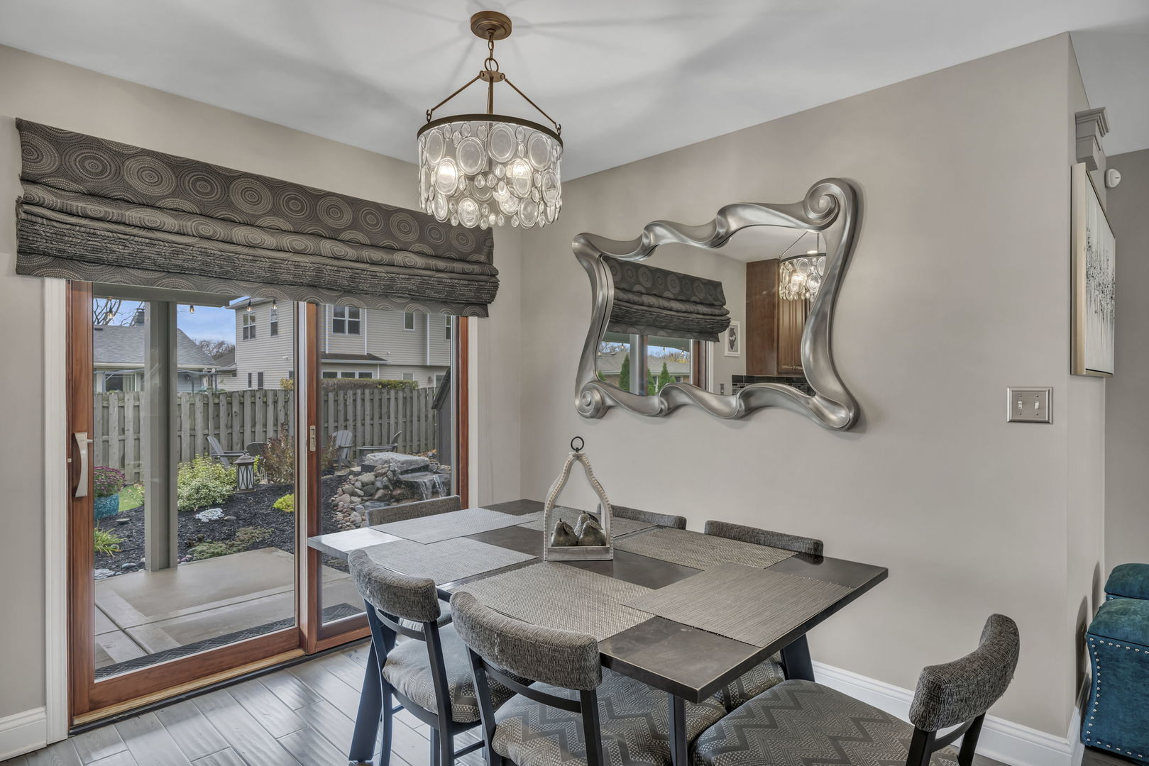 61 Avon Road Elk Grove Village, IL 60007 - Photo 11 of 41 a view of a dining room with furniture wooden floor and chandelier